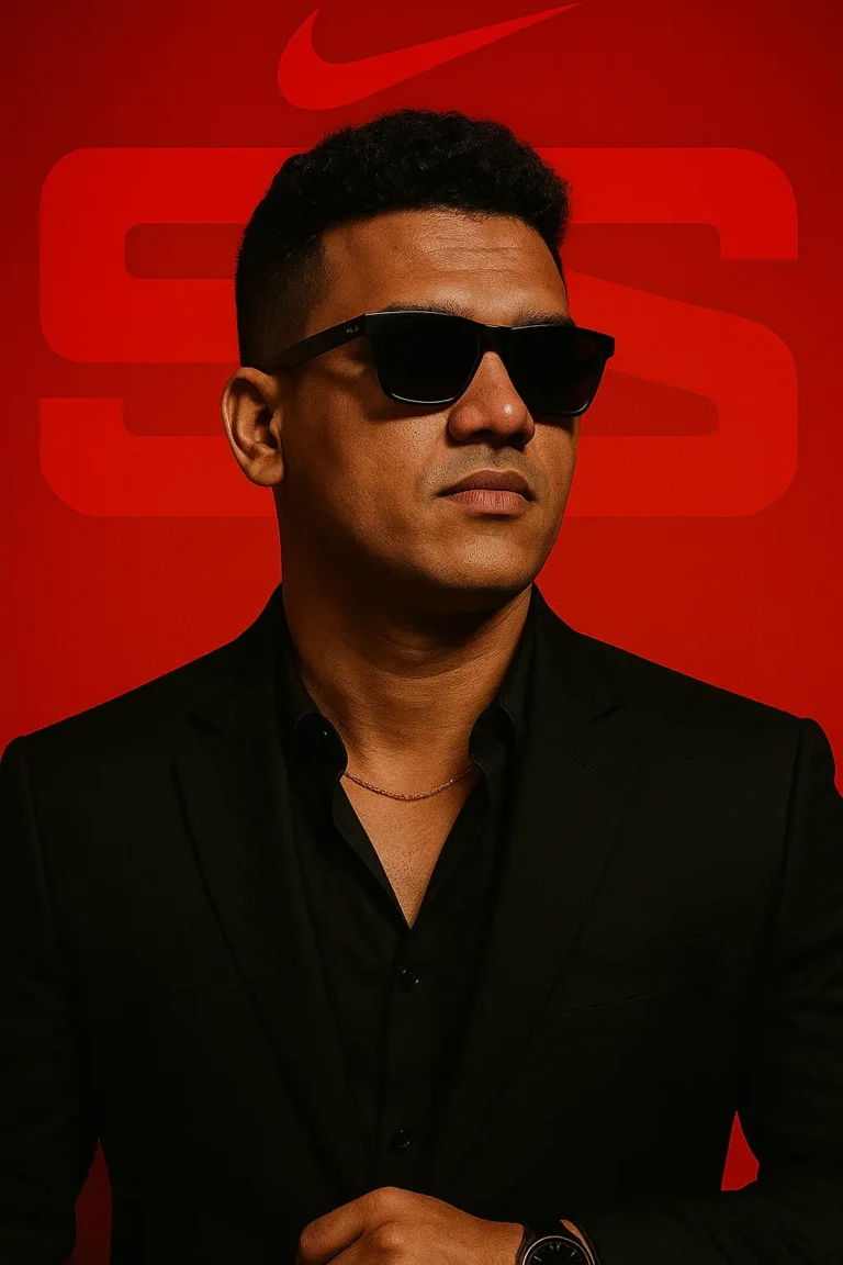 Confident man in black suit and sunglasses posing against a bold red background, representing the personal branding of the best digital marketing expert in Calicut.